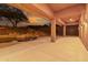 Expansive covered patio featuring an attached pool and waterfall feature perfect for relaxing or entertaining at 14056 E Desert Cove Ave, Scottsdale, AZ 85259