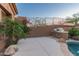 A backyard patio with a built-in grill is ideal for outdoor dining and entertainment, surrounded by desert flora at 14056 E Desert Cove Ave, Scottsdale, AZ 85259