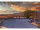 A cozy patio with desert landscaping provides a serene outdoor seating area with beautiful mountain views at 14056 E Desert Cove Ave, Scottsdale, AZ 85259