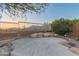 Inviting outdoor patio area with rock accents and views of mountains in the background at 14056 E Desert Cove Ave, Scottsdale, AZ 85259