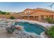 Lush backyard with pool, spa, and desert landscaping that offers ultimate relaxation and serene beauty at 14056 E Desert Cove Ave, Scottsdale, AZ 85259