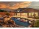 A luxurious backyard with a pool and spa offers a tranquil oasis perfect for relaxation and entertainment at 14056 E Desert Cove Ave, Scottsdale, AZ 85259