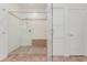 Modern shower with glass enclosure, mosaic tile accents, and convenient built-in bench at 14056 E Desert Cove Ave, Scottsdale, AZ 85259