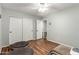 Neutral bedroom with wood floors, large closet, and a peaceful atmosphere at 14112 W Larkspur Dr, Surprise, AZ 85379