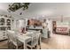 Open dining area with seating for six, adjacent to the kitchen at 14112 W Larkspur Dr, Surprise, AZ 85379