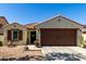 Charming single-story home with a well-manicured front yard and a two-car garage, perfect for a Gathering at 14112 W Larkspur Dr, Surprise, AZ 85379