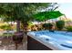 Luxurious hot tub surrounded by lush greenery, creating a private oasis for relaxation and rejuvenation at 14112 W Larkspur Dr, Surprise, AZ 85379