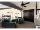 Inviting covered patio with comfortable seating and stylish outdoor decor at 14112 W Larkspur Dr, Surprise, AZ 85379