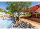 A fun playground with colorful equipment and shaded areas for children to enjoy outdoor activities at 14112 W Larkspur Dr, Surprise, AZ 85379
