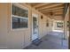 Covered back patio with tan siding and ceiling fan offers a cool and inviting outdoor space at 1519 E Indian Wells Dr, Chandler, AZ 85249