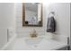 Charming bathroom with shiplap walls, a modern vanity, and gold fixtures creating a stylish and inviting space at 1519 E Indian Wells Dr, Chandler, AZ 85249