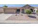 Charming single-story home with a well-manicured desert landscape and welcoming entryway at 1519 E Indian Wells Dr, Chandler, AZ 85249