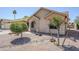 Charming home featuring desert landscaping, mature trees, and a welcoming facade at 1519 E Indian Wells Dr, Chandler, AZ 85249