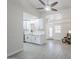 Open-concept living space features white cabinetry, tile backsplash, and modern fixtures at 1519 E Indian Wells Dr, Chandler, AZ 85249