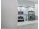 Updated kitchen with stainless steel appliances, white cabinetry, and sleek countertops offers a modern design at 1519 E Indian Wells Dr, Chandler, AZ 85249