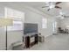 Inviting living room with tile floors, ceiling fans, and natural light creates a comfortable gathering space at 1519 E Indian Wells Dr, Chandler, AZ 85249