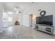 Open living area with vaulted ceilings, ceiling fan, and access to kitchen and seating area at 1519 E Indian Wells Dr, Chandler, AZ 85249
