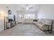Spacious living room with white leather sectional, stylish decor, and bright natural light at 1519 E Indian Wells Dr, Chandler, AZ 85249