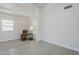 An inviting living room with neutral walls and stylish tile flooring plus a cozy leather recliner at 1519 E Indian Wells Dr, Chandler, AZ 85249