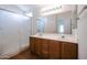 Bright bathroom with a double sink vanity and glass-enclosed shower at 15701 N Bonow Dr, Surprise, AZ 85374