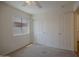 Bedroom with neutral carpet, a window, a ceiling fan, and a closet with doors at 15701 N Bonow Dr, Surprise, AZ 85374