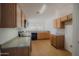 Kitchen with oak cabinets, laminate countertops, and modern appliances at 15701 N Bonow Dr, Surprise, AZ 85374