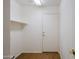 Clean and simple mud room with coat closet and tiled floors at 15701 N Bonow Dr, Surprise, AZ 85374