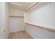 Spacious walk-in closet featuring ample shelving and hanging space at 15701 N Bonow Dr, Surprise, AZ 85374