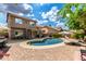Expansive backyard with a refreshing pool, brick patio, and well-maintained landscaping at 16823 S 24Th Pl, Phoenix, AZ 85048