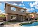 Inviting backyard featuring a sparkling pool, patio, and lush landscaping for outdoor enjoyment at 16823 S 24Th Pl, Phoenix, AZ 85048