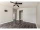 Large bedroom with dark wood floors, a ceiling fan, and recessed lighting at 16823 S 24Th Pl, Phoenix, AZ 85048