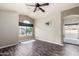 Bright bedroom with a large window, wood floors, and natural light at 16823 S 24Th Pl, Phoenix, AZ 85048