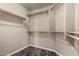 Walk-in closet with built-in shelving and wood floors at 16823 S 24Th Pl, Phoenix, AZ 85048