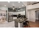 Modern kitchen with granite countertops, stainless steel appliances, and an open layout at 16823 S 24Th Pl, Phoenix, AZ 85048