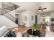 Open floor plan showing living room with stairs and dining area, with hardwood floors at 16823 S 24Th Pl, Phoenix, AZ 85048