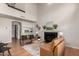 Inviting living room with a fireplace, comfortable seating, and access to other rooms at 16823 S 24Th Pl, Phoenix, AZ 85048