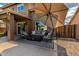 Covered patio area with comfortable seating, perfect for outdoor lounging and entertaining by the pool at 16823 S 24Th Pl, Phoenix, AZ 85048