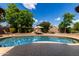 Backyard pool with lounge chairs and shade under a bright blue sky at 16823 S 24Th Pl, Phoenix, AZ 85048
