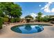 The refreshing backyard pool is surrounded by lush landscaping and a spacious patio area at 16823 S 24Th Pl, Phoenix, AZ 85048