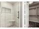 Updated tile shower with glass door, niche, and bench at 16823 S 24Th Pl, Phoenix, AZ 85048