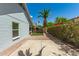 Spacious backyard with desert landscaping, including a palm tree and artificial turf at 18219 N 19Th St, Phoenix, AZ 85022