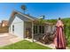 Exterior backyard view featuring a patio with furniture and an artificial grass area at 18219 N 19Th St, Phoenix, AZ 85022