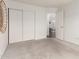 Bright and spacious bedroom with neutral carpet, closet and doorway to other rooms at 18219 N 19Th St, Phoenix, AZ 85022