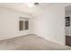 Bedroom featuring carpeted floors, a sliding door closet, and a sunlit window at 18219 N 19Th St, Phoenix, AZ 85022