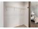 Walk-in closet with wire shelving offers ample storage space, conveniently located adjacent to the bedroom at 18219 N 19Th St, Phoenix, AZ 85022