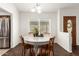 Cozy dining area features a round table, wood chairs, and natural light, perfect for Gathering meals at 18219 N 19Th St, Phoenix, AZ 85022