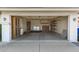 Spacious two-car garage featuring laundry hookups, storage cabinets, and built-in shelving at 18219 N 19Th St, Phoenix, AZ 85022