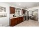 Modern kitchen with stainless steel appliances, granite countertops, and dark wood cabinetry at 18219 N 19Th St, Phoenix, AZ 85022