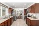 Contemporary kitchen featuring stainless appliances, granite countertops, and stylish dark wood cabinetry at 18219 N 19Th St, Phoenix, AZ 85022