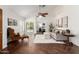 Bright living room featuring backyard access, neutral decor, and vaulted ceilings, creating an inviting space at 18219 N 19Th St, Phoenix, AZ 85022